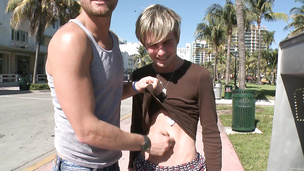 Blonde twink gets seduced by big dicked hunk in public