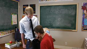 Ravishing twink sucks his teacher on his cozy classroom table